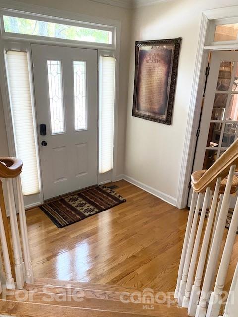 7923 Harrington Woods Road Charlotte, NC 28269 - Photo 5 of 15 a view of an empty room with wooden floor and a window