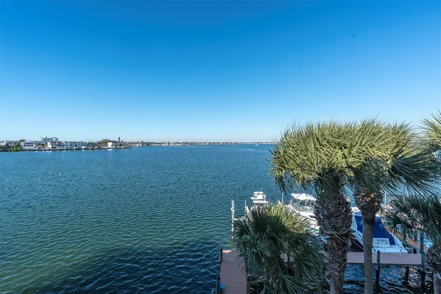 a bedroom with a bed and a lamp