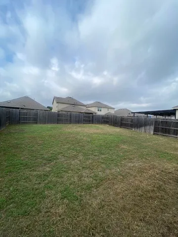 a view of a big room with a big yard and a fountain