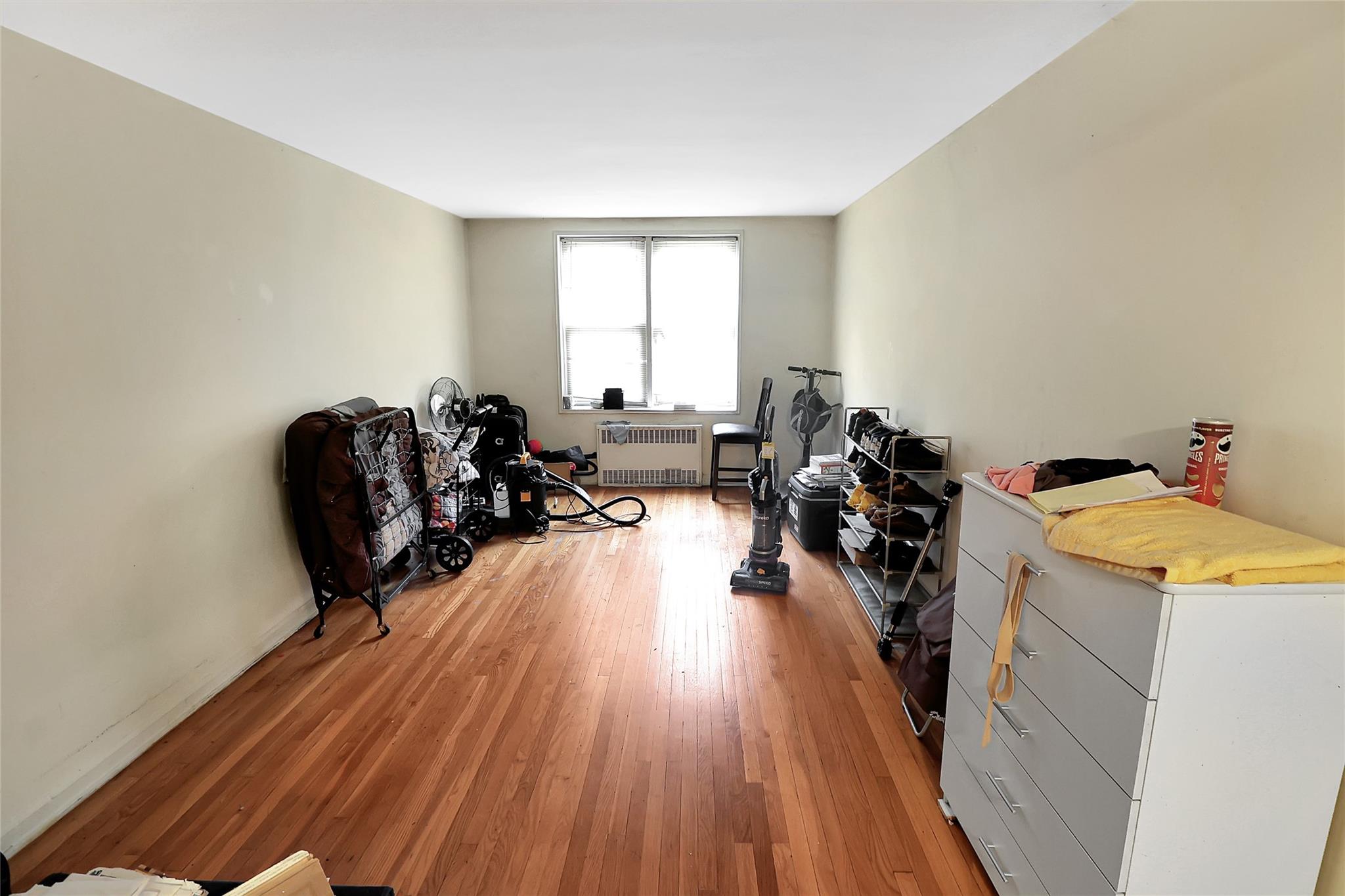 2105 Wallace Avenue, Unit 4A Bronx, NY 10462 - Photo 14 of 29 a living room with furniture a window and wooden floor
