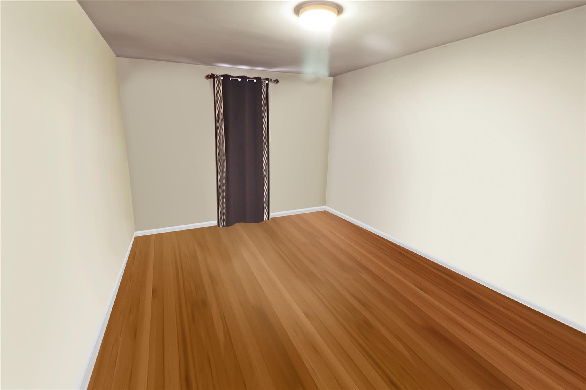 2105 Wallace Avenue, Unit 4A Bronx, NY 10462 - Photo 17 of 29 a view of a room with a wooden floor
