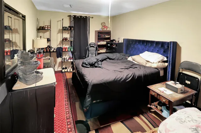 a bedroom with furniture and a bed