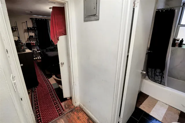 a bathroom with a sink and mirror with toilet