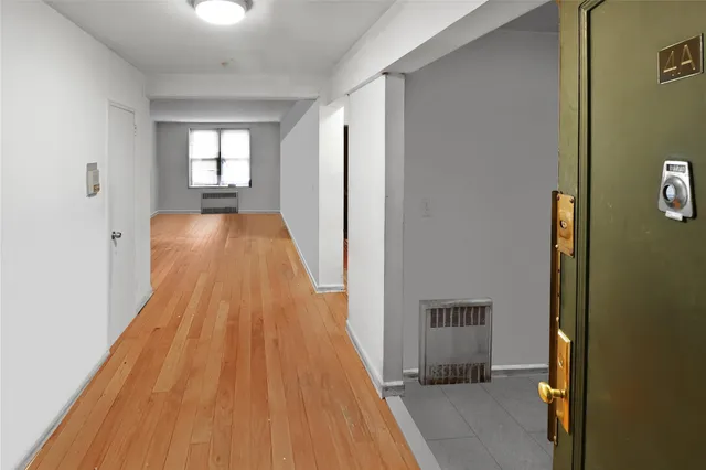 a view of a living room and a wooden floor