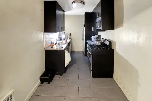 a kitchen with a stove and a sink