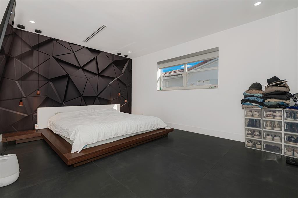 5300 Garfield Street Hollywood, FL 33021 - Photo 11 of 27 a bedroom with a bed and a window