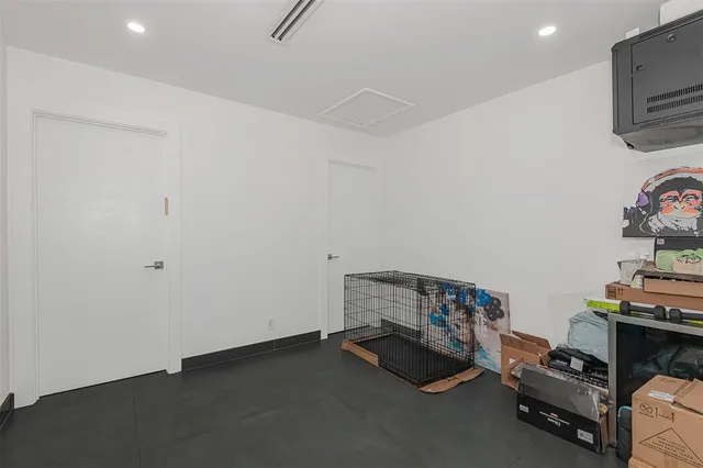 a view of room with toys and wooden floor