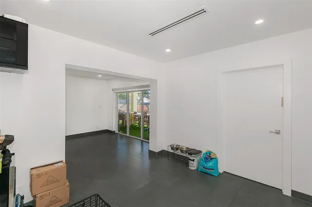 a bedroom with bed and a windows