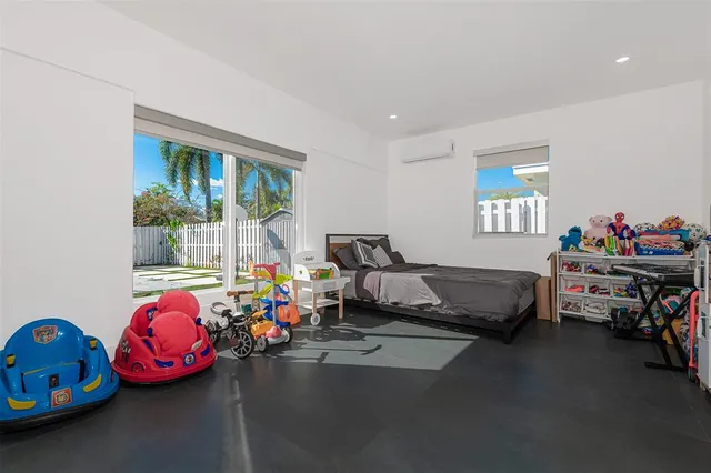 a bedroom with furniture and a window