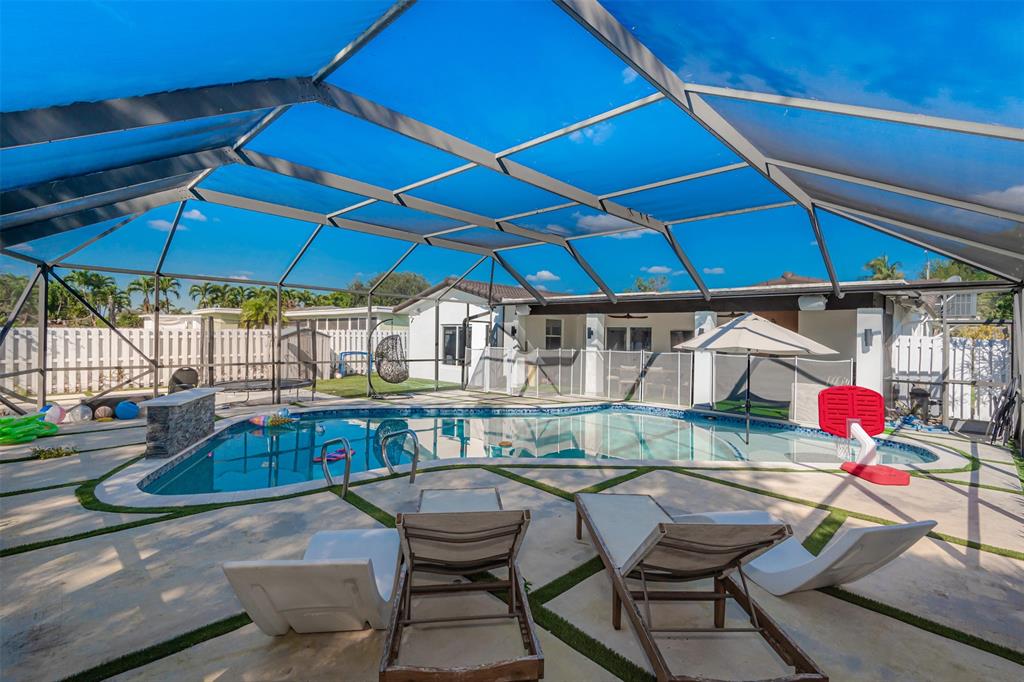 5300 Garfield Street Hollywood, FL 33021 - Photo 25 of 27 a view of a backyard with sitting area and furniture