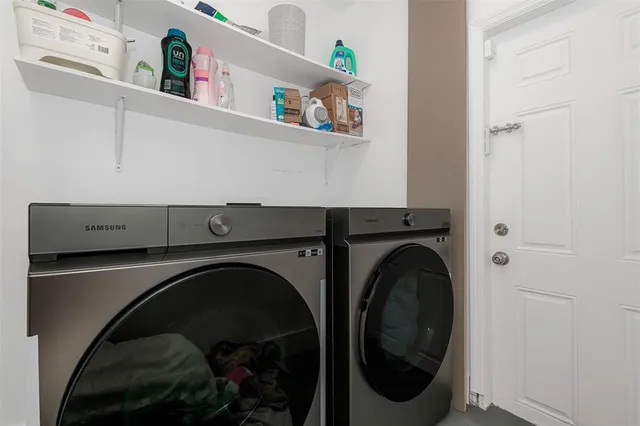a bathroom with a granite countertop sink a toilet and shower