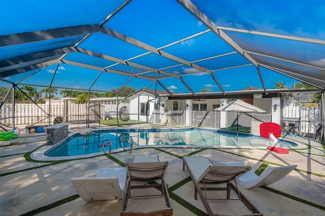 a view of a backyard with a small cabin and a chair