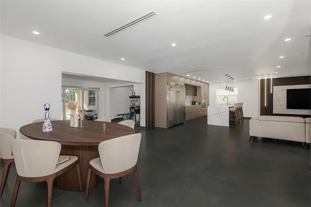 a kitchen with sink and refrigerator
