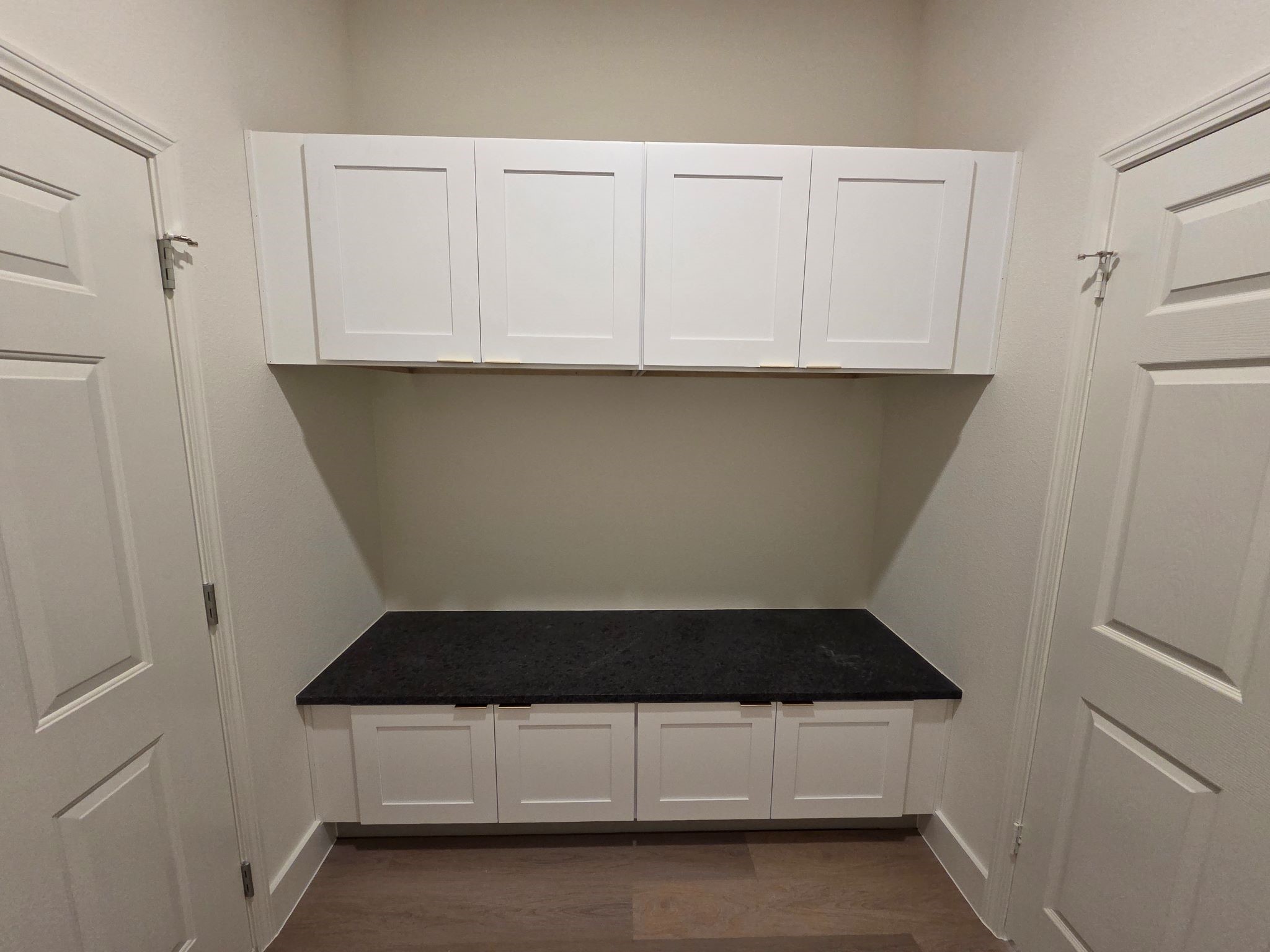 16280 Jeet Street Conroe, TX 77306 - Photo 16 of 31 a kitchen with white cabinets and white appliances