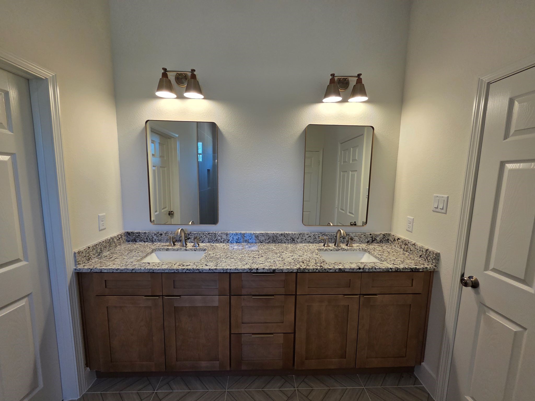 16280 Jeet Street Conroe, TX 77306 - Photo 21 of 31 a bathroom with a sink and a mirror