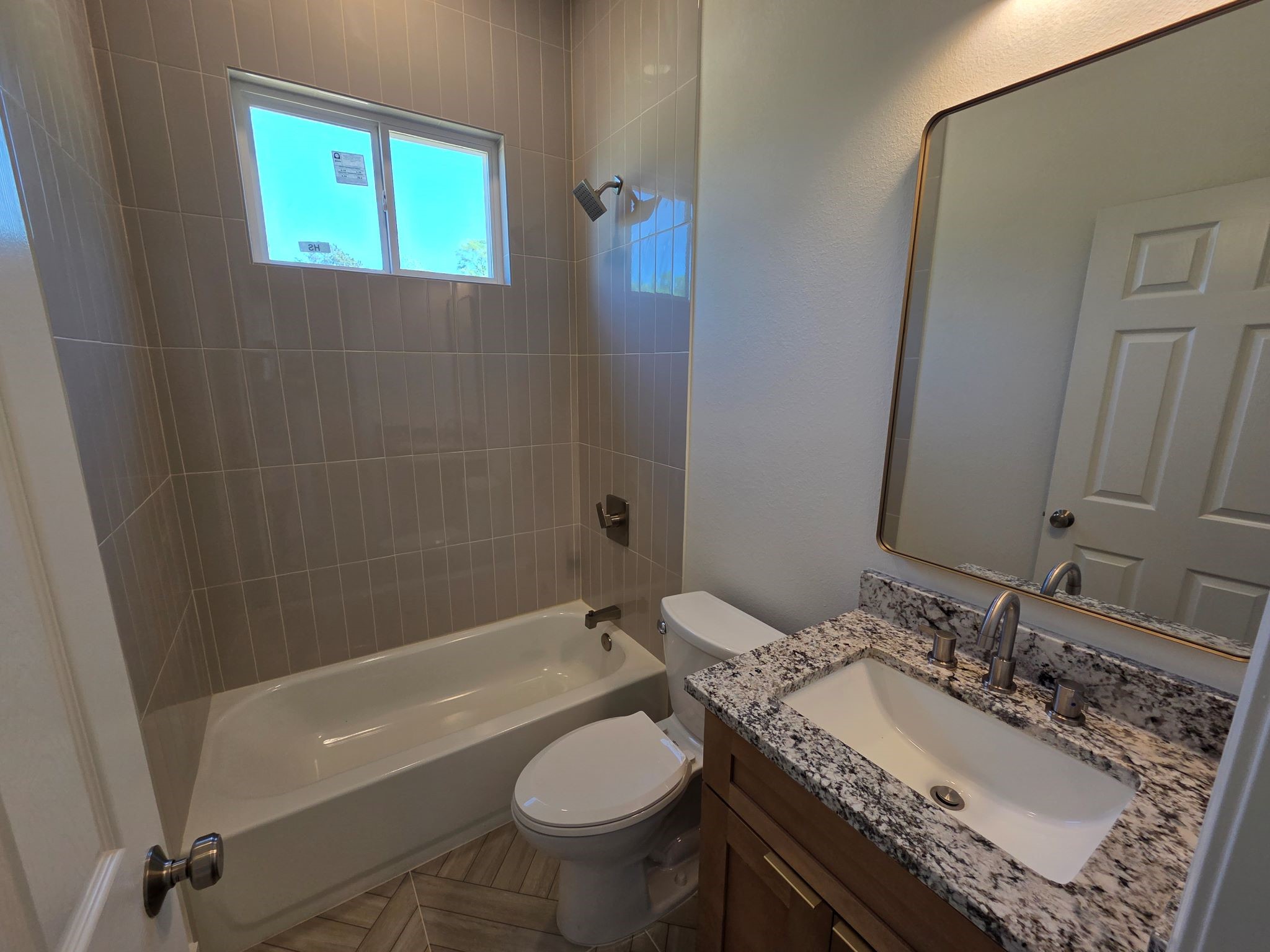16280 Jeet Street Conroe, TX 77306 - Photo 26 of 31 a bathroom with a granite countertop sink toilet and shower