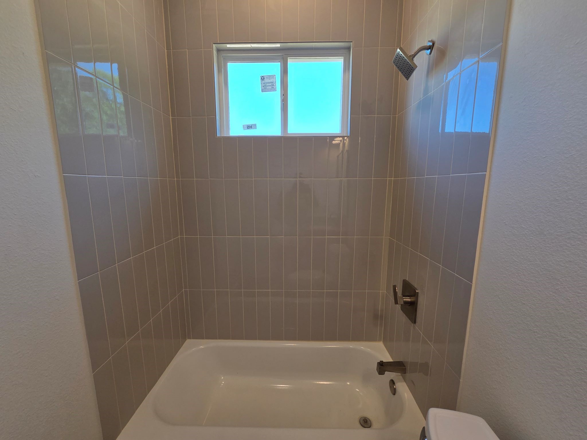 16280 Jeet Street Conroe, TX 77306 - Photo 27 of 31 a bathroom with a bathtub and a shower