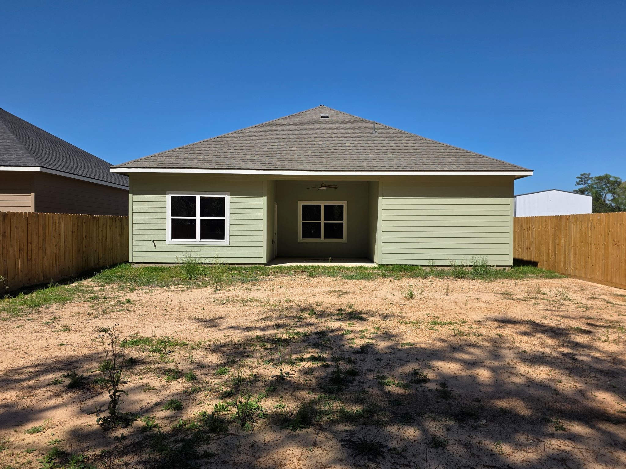16280 Jeet Street Conroe, TX 77306 - Photo 28 of 31 a backyard of a house