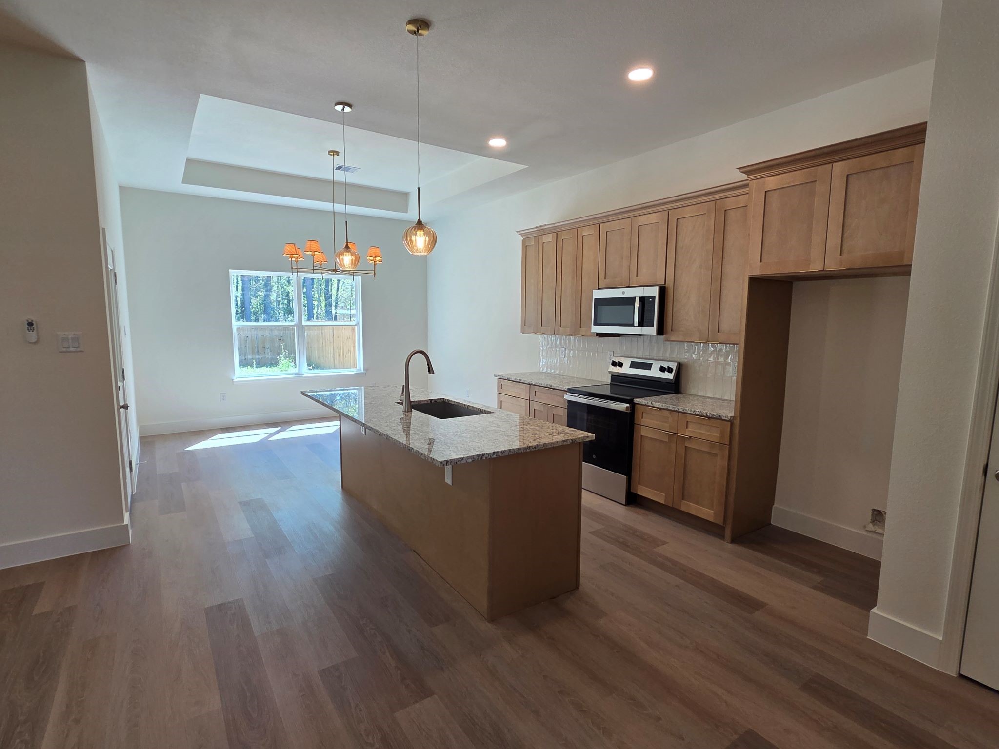 16280 Jeet Street Conroe, TX 77306 - Photo 10 of 31 a kitchen with counter top space and stainless steel appliances
