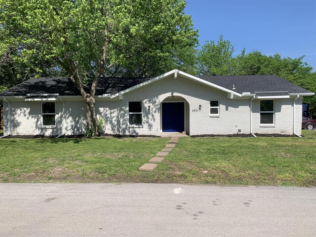 Ranch-style home featuring a front lawn, a shingled roof, and brick siding