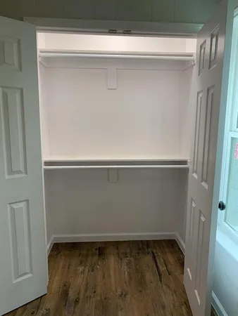 a bathroom with a toilet and a bathtub