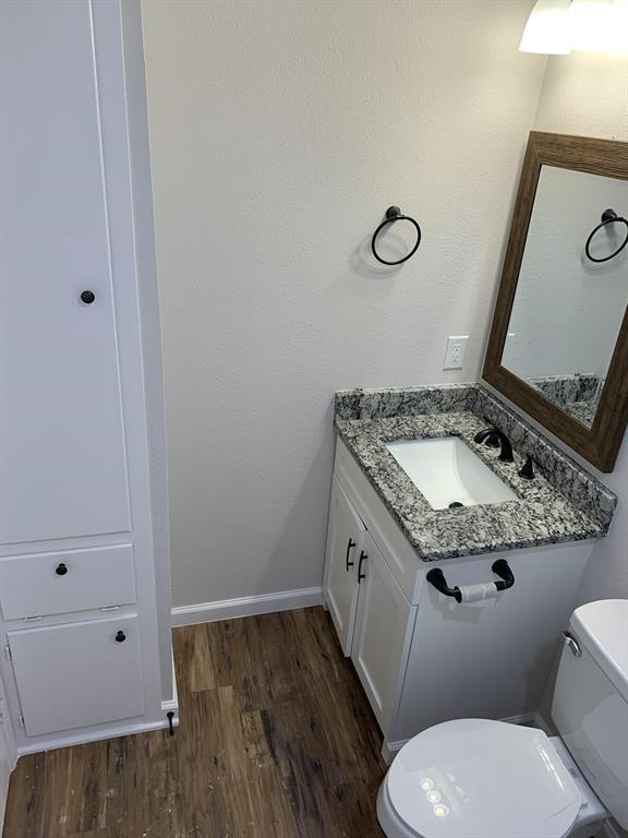 105 Still Street Kemp, TX 75143 - Photo 15 of 28 Bathroom with vanity and dark wood finished floors