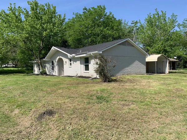 a front view of a house with yard