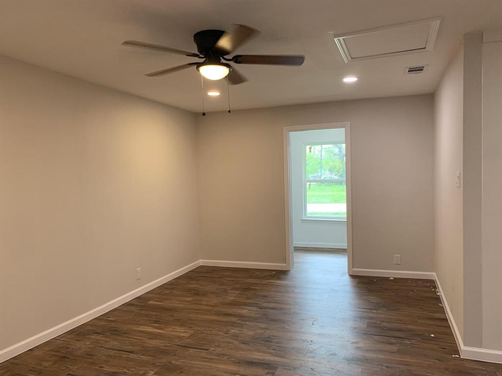 105 Still Street Kemp, TX 75143 - Photo 6 of 28 Unfurnished room with a ceiling fan, dark wood-style flooring, and recessed lighting