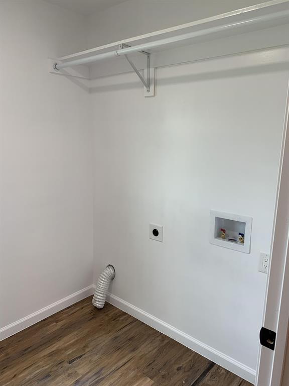 105 Still Street Kemp, TX 75143 - Photo 7 of 28 Laundry area featuring dark wood-style flooring, hookup for an electric dryer, and washer hookup