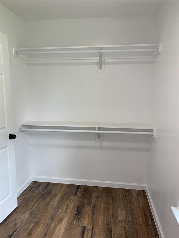 105 Still Street Kemp, TX 75143 - Photo 8 of 28 Walk in closet with dark wood finished floors