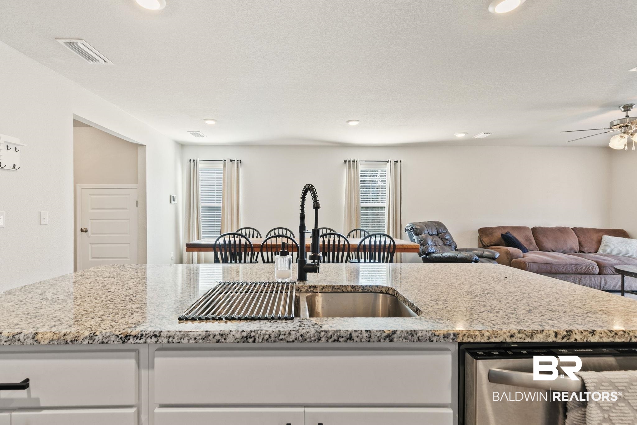 32234 Calder Court Daphne, AL 36527 - Photo 12 of 32 Kitchen with white cabinets, light stone counters, dishwasher, healthy amount of natural light, and recessed lighting