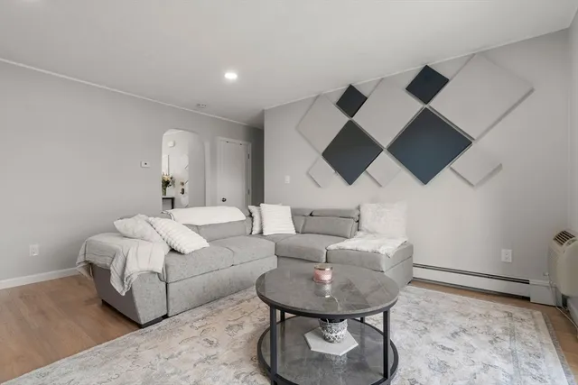 a living room with furniture and a rug