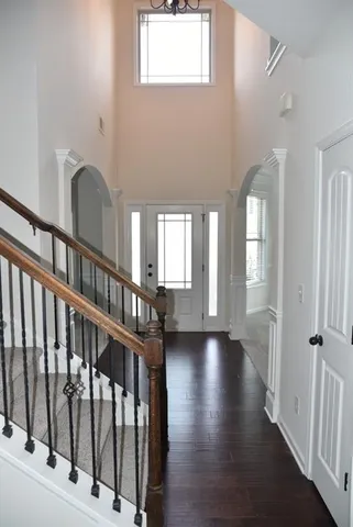 a view of an entryway with wooden floor