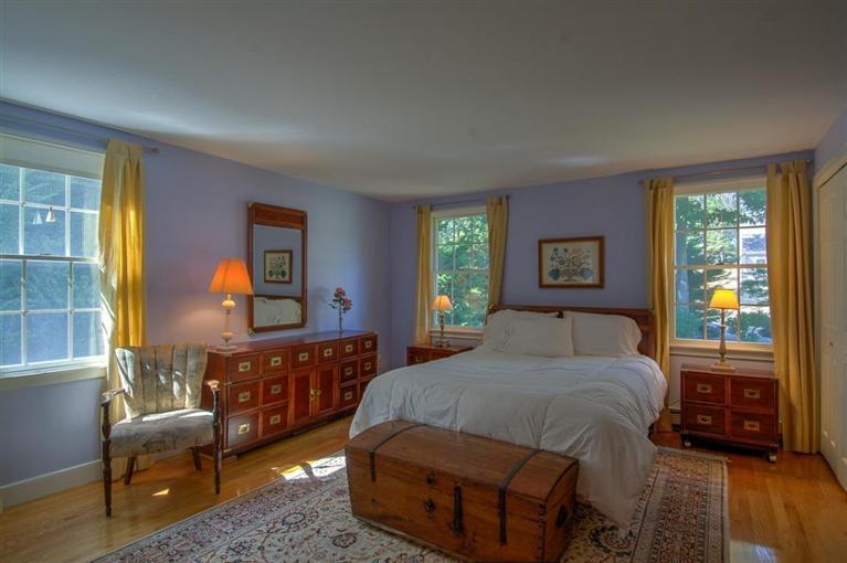 29 David Street Osterville, MA 02655 - Photo 14 of 26 a bedroom with a bed and wooden floor