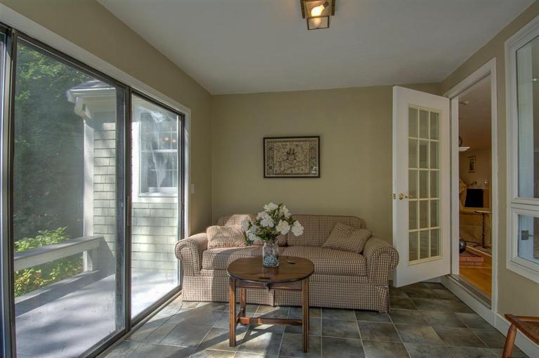29 David Street Osterville, MA 02655 - Photo 21 of 26 a living room with furniture and a floor to ceiling window