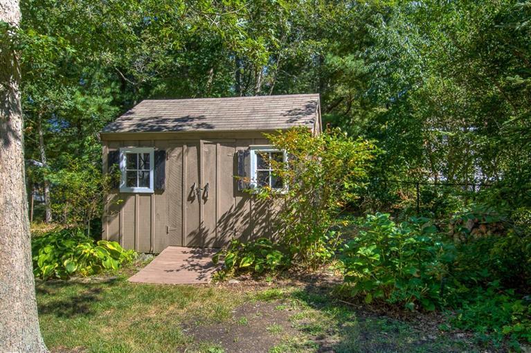 29 David Street Osterville, MA 02655 - Photo 25 of 26 a view of a house with a small yard plants and large tree