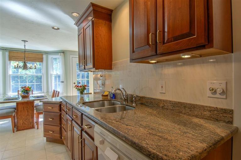 29 David Street Osterville, MA 02655 - Photo 8 of 26 a kitchen with granite countertop a sink a stove and cabinets