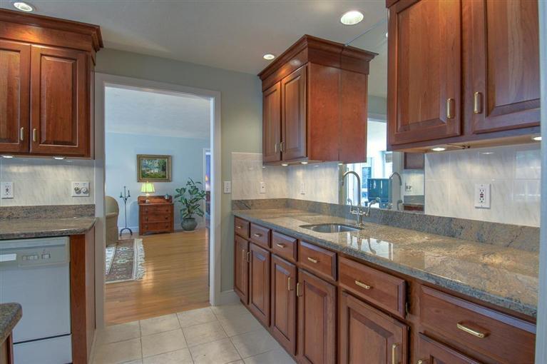 29 David Street Osterville, MA 02655 - Photo 10 of 26 a kitchen with granite countertop a sink stove and cabinets