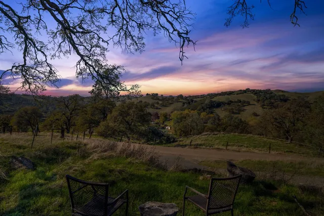 a view of outdoor seating and green space