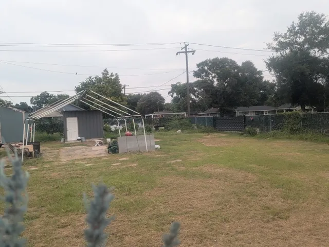a backyard of a house with lots of green space
