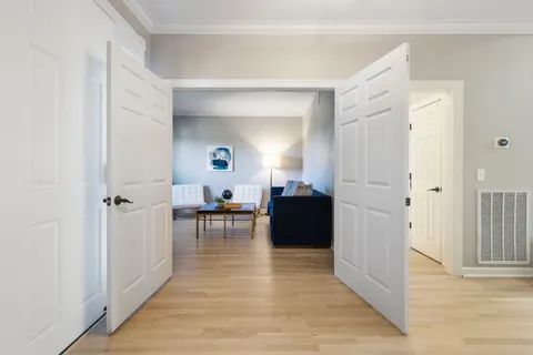 a kitchen with granite countertop a stove and a wooden cabinets