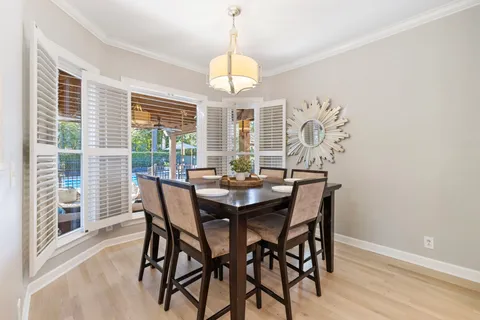 a view of a chairs and table on the wooden floor