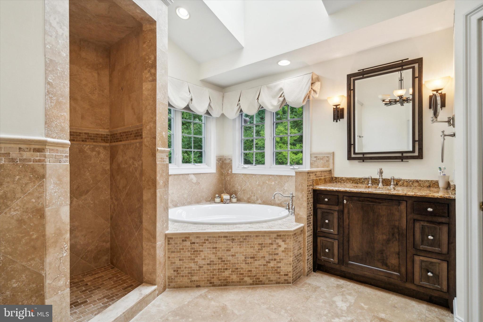 145 Biddulph Road Wayne, PA 19087 - Photo 21 of 38 a spacious bathroom with a tub sink and mirror