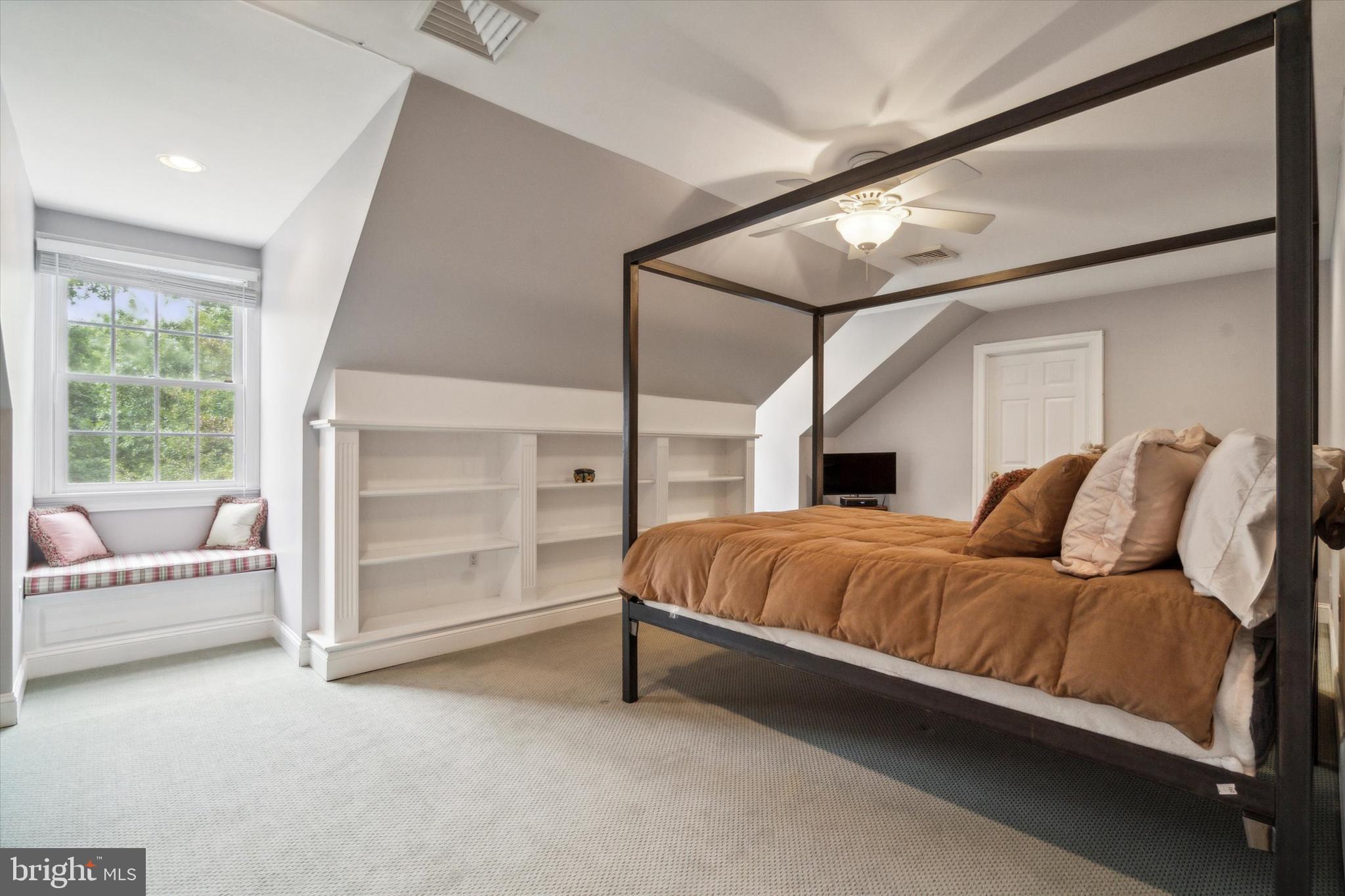 145 Biddulph Road Wayne, PA 19087 - Photo 29 of 38 a bedroom with a bed and a couch