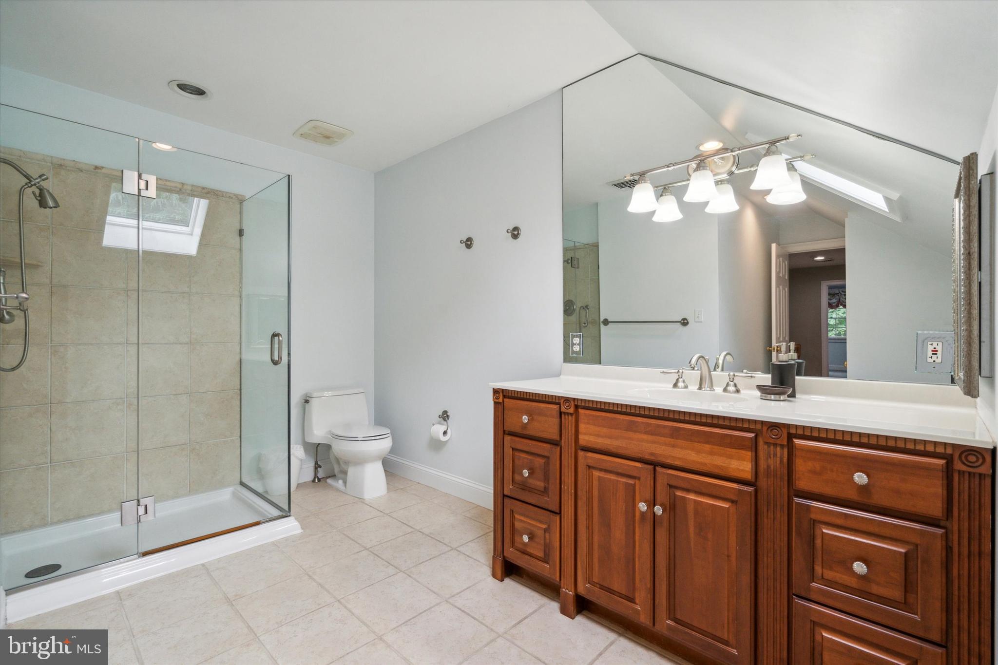145 Biddulph Road Wayne, PA 19087 - Photo 30 of 38 a bathroom with a double vanity sink and a toilet