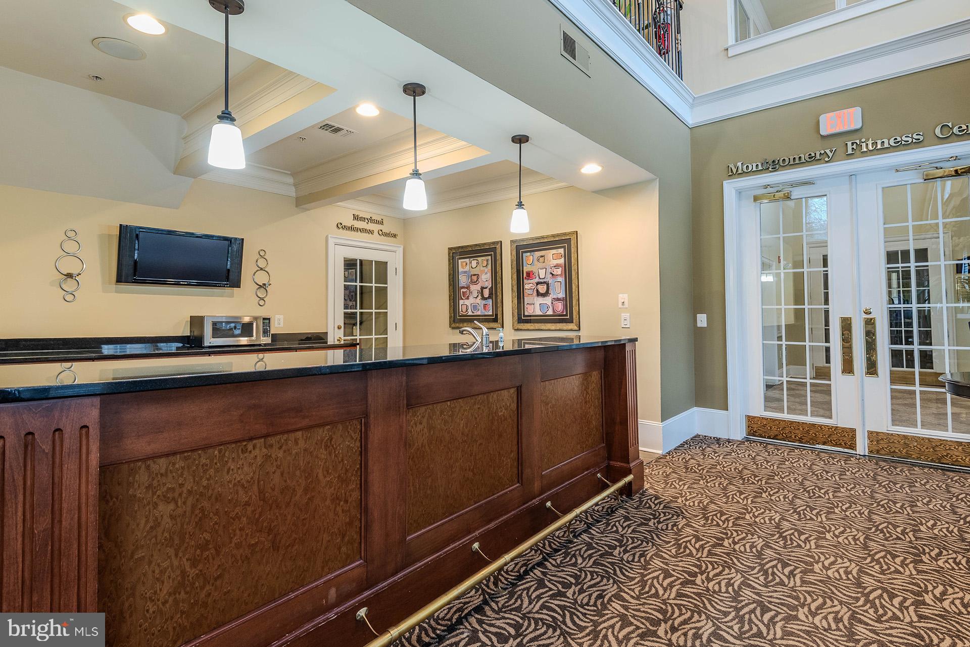 11800 Old Georgetown Road, Unit 1632 North Bethesda, MD 20852 - Photo 25 of 35 a living room with wooden floor and flat screen tv