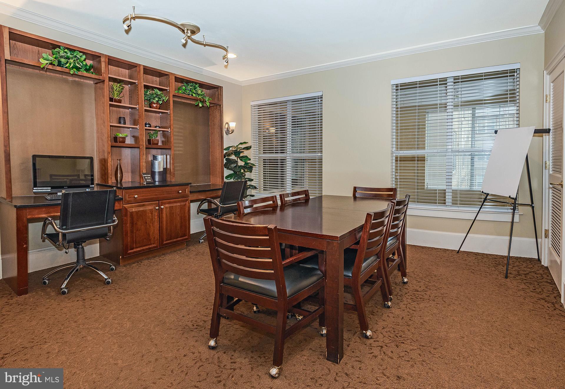 11800 Old Georgetown Road, Unit 1632 North Bethesda, MD 20852 - Photo 28 of 35 a dining room with a wooden table and chairs