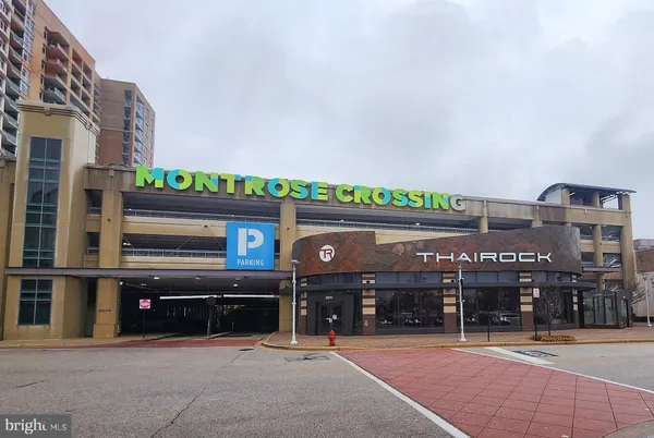 a front view of a building with retail shops