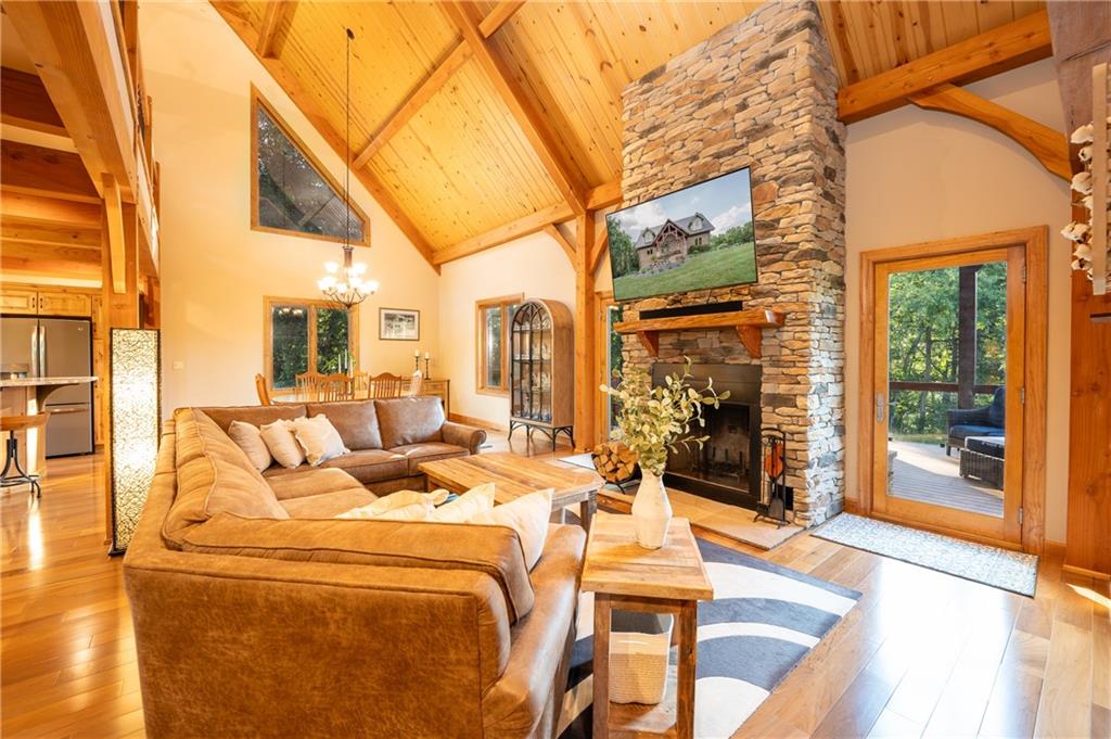 2780 Ipnar Road Irwin, PA 15642 - Photo 14 of 40 a view of a patio with couches table and chairs and wooden floor