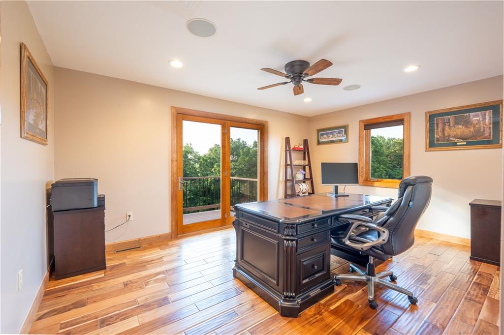 2780 Ipnar Road Irwin, PA 15642 - Photo 23 of 40 a room with gym equipment and large windows